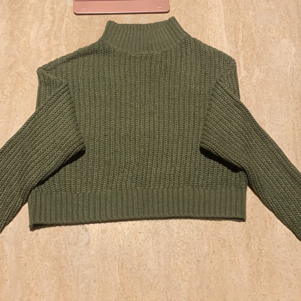 Divided crop green sweater in good condition. Size XS